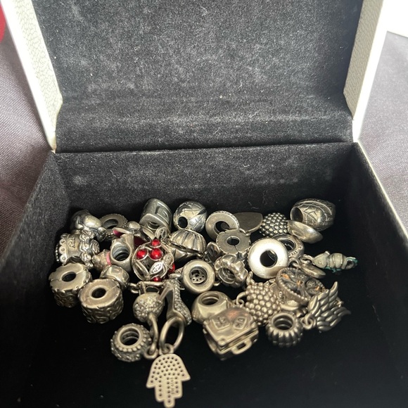 Lot of 26 Authentic Pandora charms.